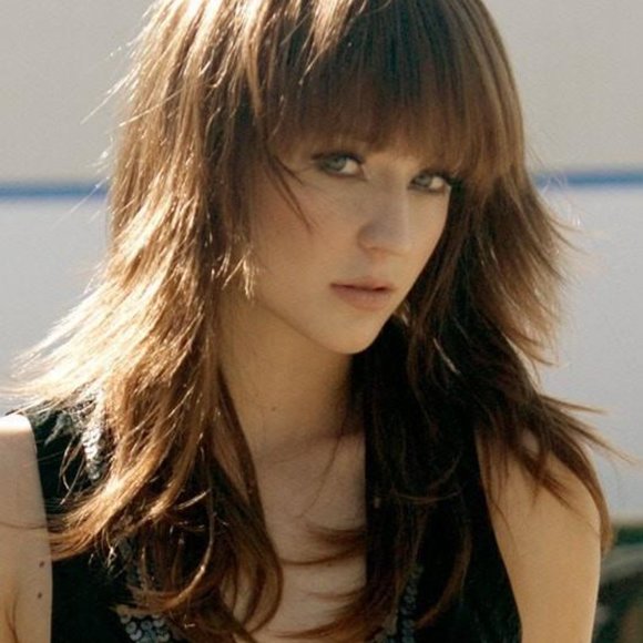 A modern edgy shag style is long and luscious with full choppy layers and bangs. main image 15